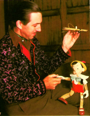 1939: Walt holding animator's reference model of Pinocchio